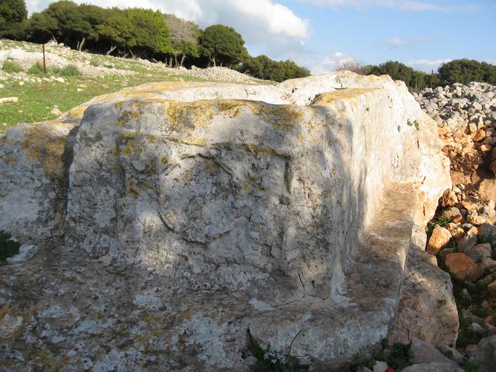 On top of the hill, on the side facing Keren-Carmel, is an unfinish stone coffin.