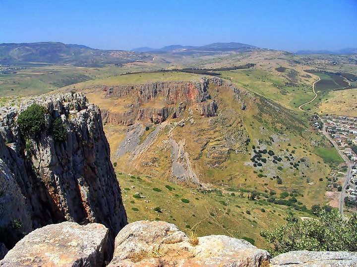The photo is taken on top of the cliffs, looking west, overlooking the Arbel valley. 