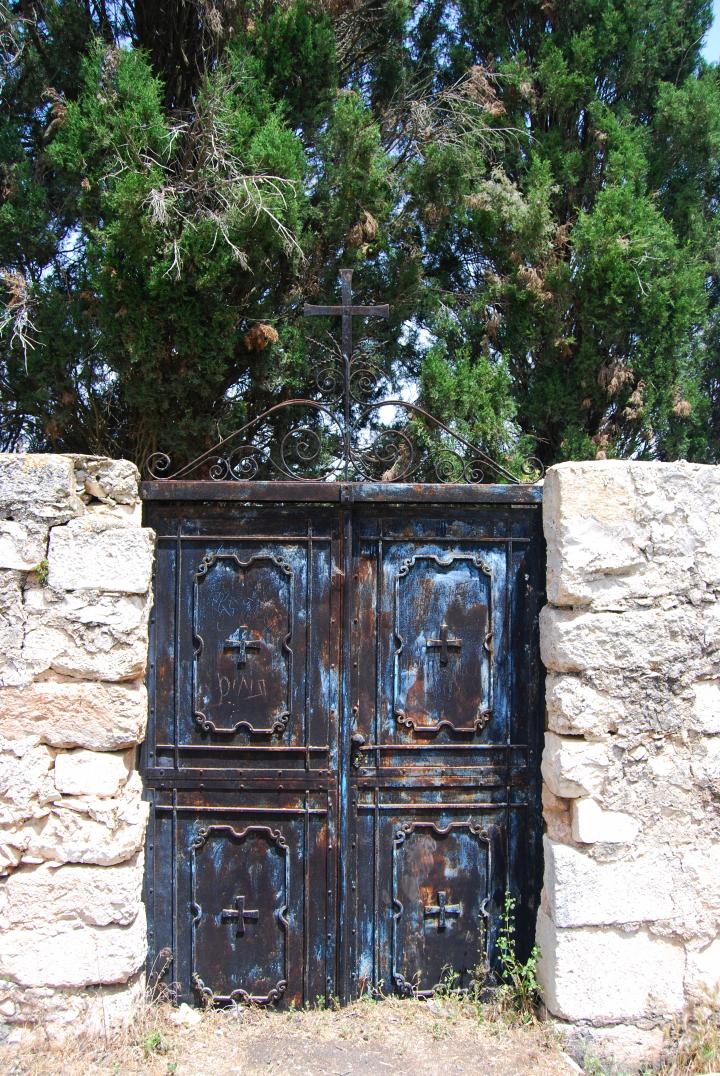 Gate in the wall along the access road to the Franciscan Monastery